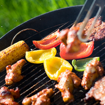 Safe grilling of cooked chicken and raw vegetables